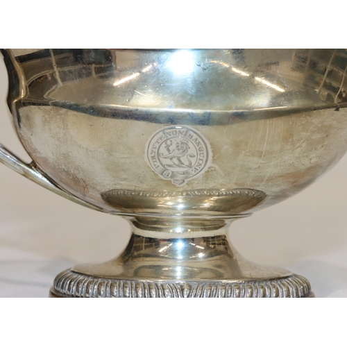 203 - An early George III silver oval sauce boat with gadroon rim, reeded handle, on oval splayed base, en... 