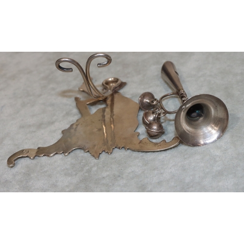 217 - A Continental silver coloured metal menu holder in the form of a cupid, on splayed base, 8cm high an... 