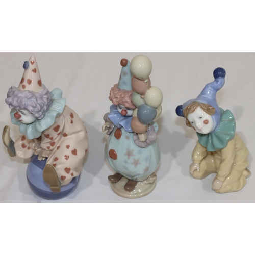 22 - 2 Lladro figurines of clowns, 18cm high and a similar Nao figure (3)