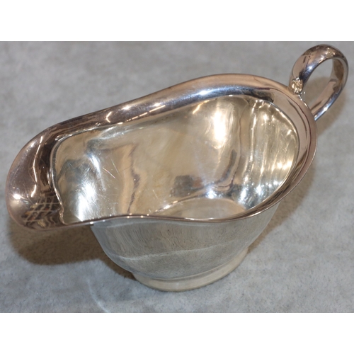 224 - A silver small sauceboat with scroll handle, Sheffield 1944, 3.1oz