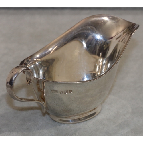 224 - A silver small sauceboat with scroll handle, Sheffield 1944, 3.1oz