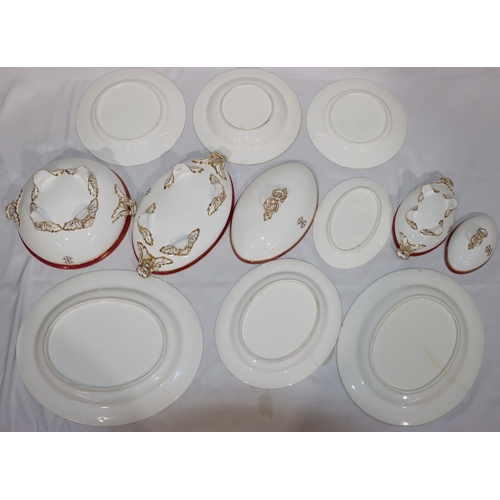 24 - A Worcester dinner service on white ground with red rims and gilt key pattern decoration, all mounte... 