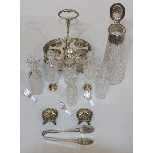 240 - An oval cut glass and silver plated claret jug, an oval silver plated cruet stand with centre carryi... 