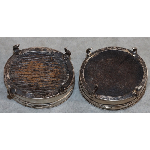 252 - 2 near matching George V oval silver trinket boxes with hinged tortoiseshell lids, on 4 splayed legs... 