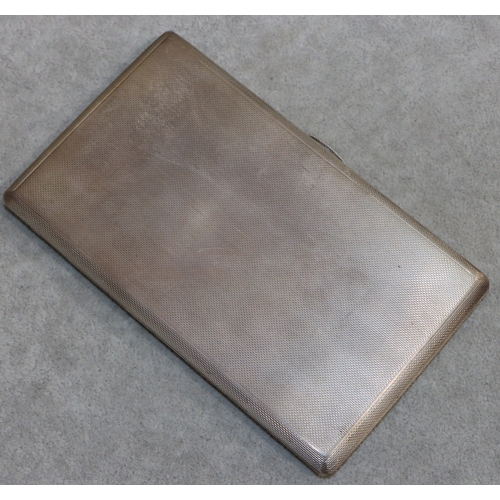 263 - A large London silver cigarette case with allover engine turned decoration and hinged front, 14cm lo... 