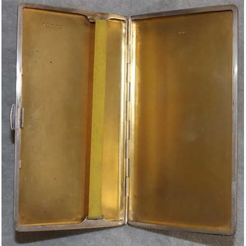 263 - A large London silver cigarette case with allover engine turned decoration and hinged front, 14cm lo... 