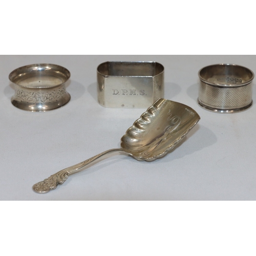 267 - A Birmingham silver rectangular shaped napkin ring, 2 circular napkin rings and a sterling silver ca... 