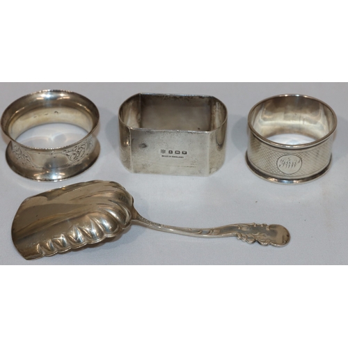 267 - A Birmingham silver rectangular shaped napkin ring, 2 circular napkin rings and a sterling silver ca... 