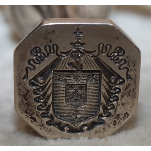 273 - A heavy Continental silver coloured metal desk seal with cast bird and lion motif to top, fluted ste... 