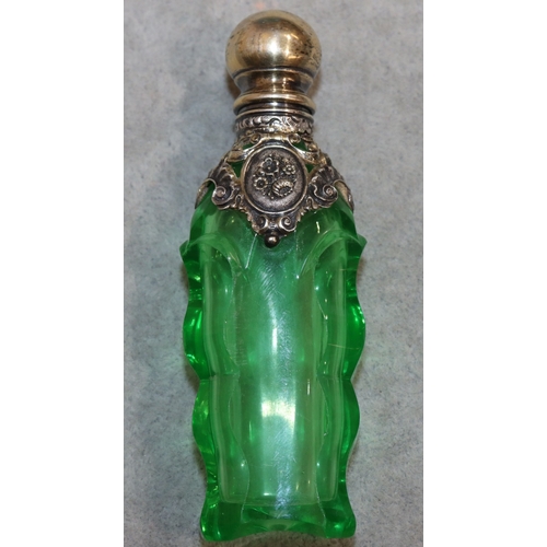 276 - A 19th Century cut glass rectangular shaped scent bottle with thumb pattern decoration and silver an... 