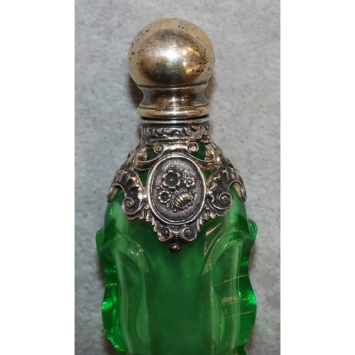 276 - A 19th Century cut glass rectangular shaped scent bottle with thumb pattern decoration and silver an... 