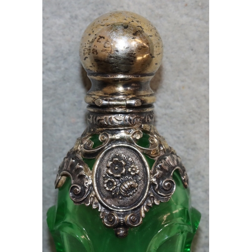 276 - A 19th Century cut glass rectangular shaped scent bottle with thumb pattern decoration and silver an... 