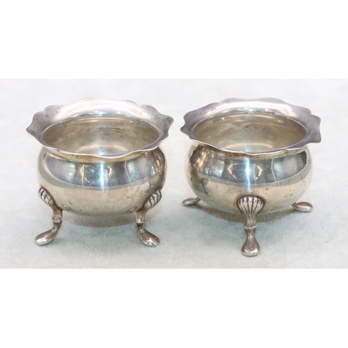 281 - A pair of Edward VII small round bulbous thin necked trumpet shaped salts with crinkled rims on spla... 