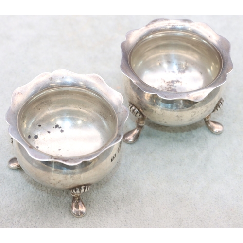 281 - A pair of Edward VII small round bulbous thin necked trumpet shaped salts with crinkled rims on spla... 