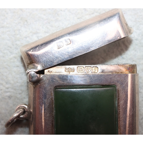 283 - An Edward VII silver vesta case inset with rectangular jade panel, Chester 1906, maker's mark C&S, o... 