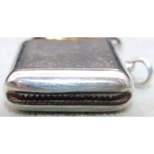 284 - A George V Sampson Mordan & Co. heavy silver vesta case with allover engine turned decoration and hi... 