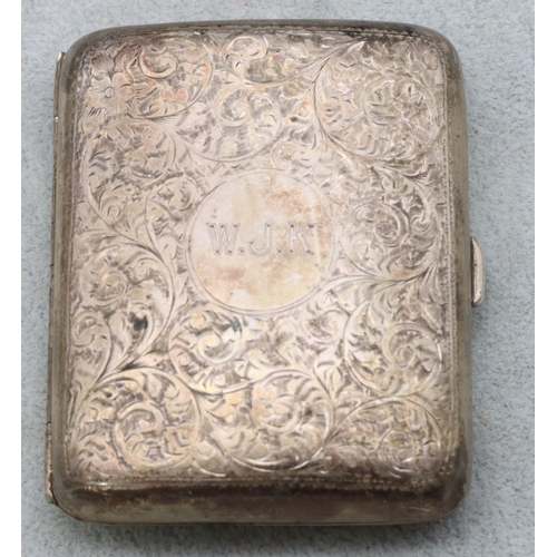 286 - A concave shaped cigarette case with allover chased floral and scroll decoration and hinged front, B... 