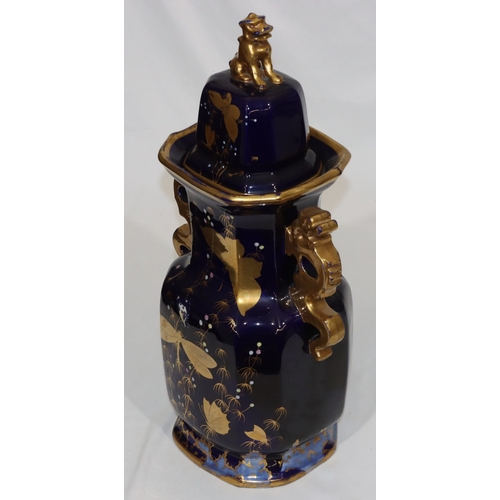 31 - A large 19th Century bulbous thin necked trumpet shaped 2-handled lidded vase on royal blue ground a... 