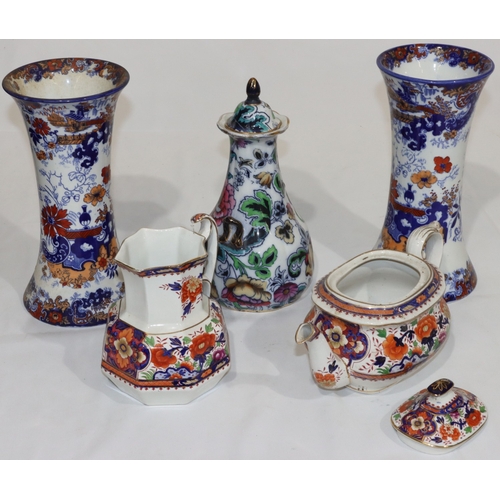 33 - A pair of round bulbous trumpet shaped vases on white and blue ground with coloured floral, leaf, va... 