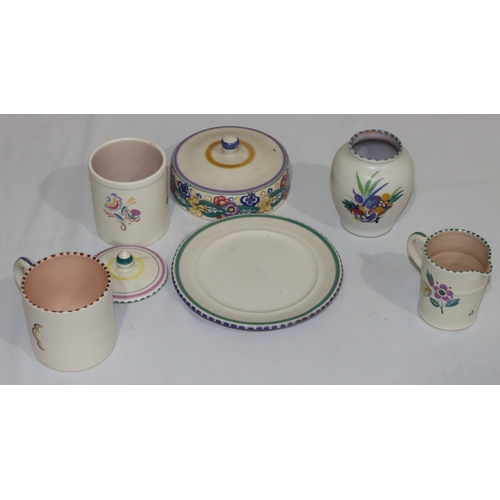 38 - 5 Poole Pottery items, including a mug with coloured figure decoration, a lidded butter dish, a lidd... 