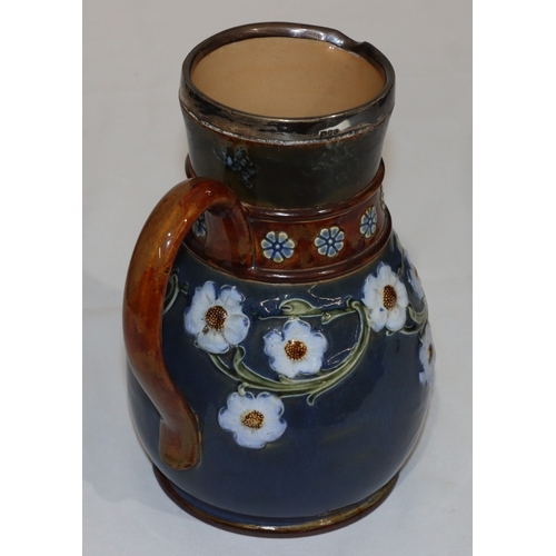 4 - A Doulton & Lambeth round bulbous jug with London silver rim on blue and brown ground with raised co... 