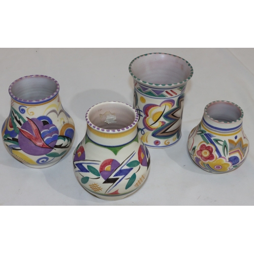 44 - A Poole Pottery round trumpet shaped vase with multi-coloured decoration, 12cm high and 3 various sm... 