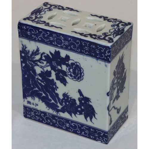 56 - An Oriental blue and white rectangular shaped pillow with animal, floral, leaf and scroll decoration... 