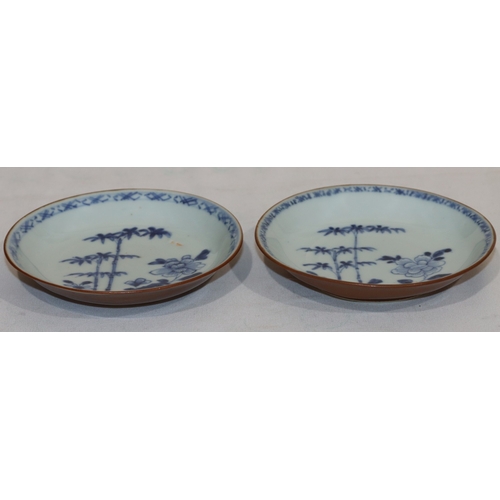 58 - A pair of Tek Sing blue and white lotus dishes with floral and bamboo decoration, 12cm diameter, wit... 