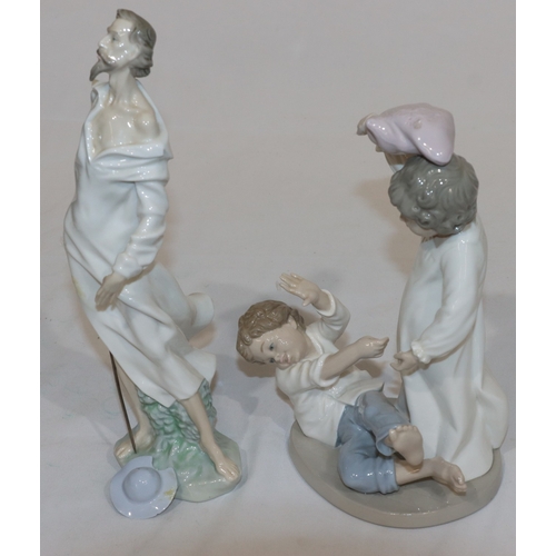 61 - A Nao group of 2 children having a pillow fight, 24cm high and a Lladro figure of Don Quixote (hat l... 