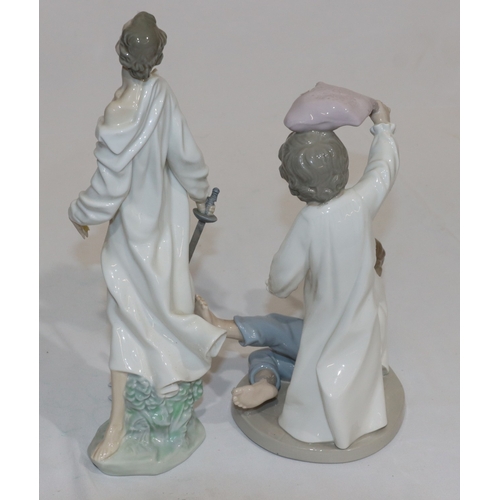 61 - A Nao group of 2 children having a pillow fight, 24cm high and a Lladro figure of Don Quixote (hat l... 