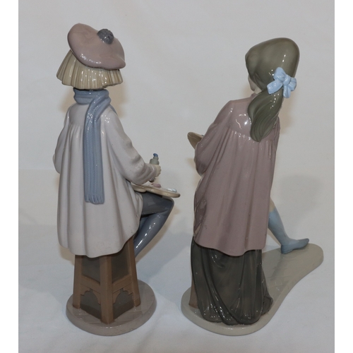 62 - 2 large Nao figures of seated young artist girls (1 base restored and 1 brush restored), largest 33c... 