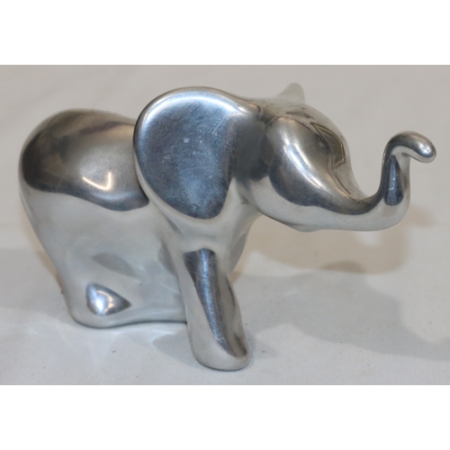 687 - Hoselton, Canadian aluminium sculpture of an elephant, labelled and signed with number 2046, 10.5cm ... 