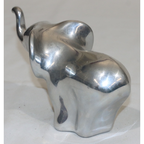 687 - Hoselton, Canadian aluminium sculpture of an elephant, labelled and signed with number 2046, 10.5cm ... 