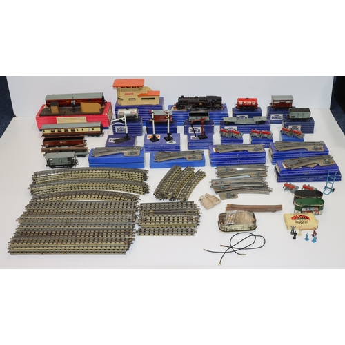 693 - A quantity of Hornby Dublo engines, trucks, carriages, signal cabin, track etc.