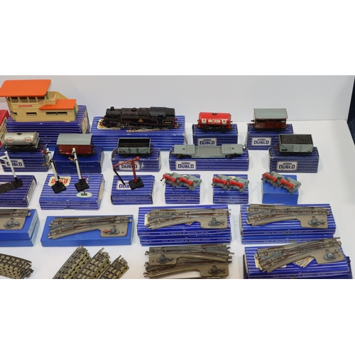 693 - A quantity of Hornby Dublo engines, trucks, carriages, signal cabin, track etc.