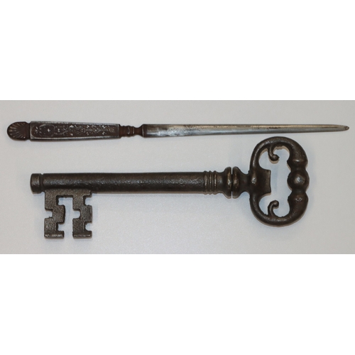 694 - A George III Indenture (framed), a large corkscrew in the form of a key, a silver plated paperknife,... 