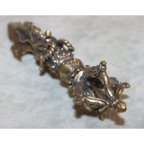 700 - A gilt metal small dagger with raised dragon decoration, 11cm long