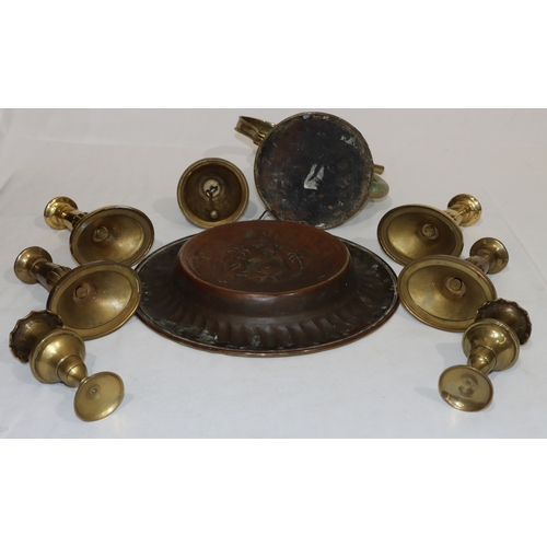 705 - A brass circular dish with embossed figure and lion motif, 31cm diameter, a brass coffee pot, 4 bras... 