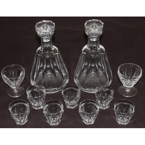 71 - A pair of Baccarat octagonal bulbous thin necked decanters with stoppers and chamfer decoration, 7 m... 