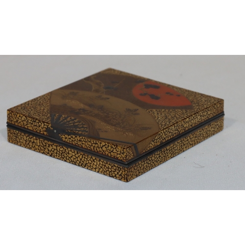 721 - A signed Oriental lacquered square box on gilt ground with fan, floral and leaf decoration, with cov... 