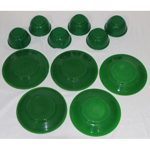 73 - A set of 6 Peking green glass bowls (1 rim badly chipped), 11.5cm diameter and 5 matching plates (1 ... 