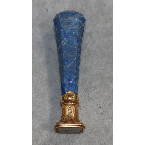 734 - A desk top seal with Lapis Lazuli bulbous handle with chamfer decoration, gilt stamp set with white ... 