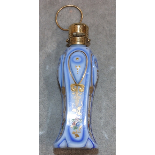 735 - An Opaline and blue pentagon shaped bulbous scent bottle with gilt metal neck and hinged lid, with c... 