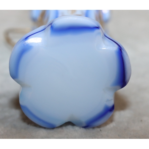 735 - An Opaline and blue pentagon shaped bulbous scent bottle with gilt metal neck and hinged lid, with c... 