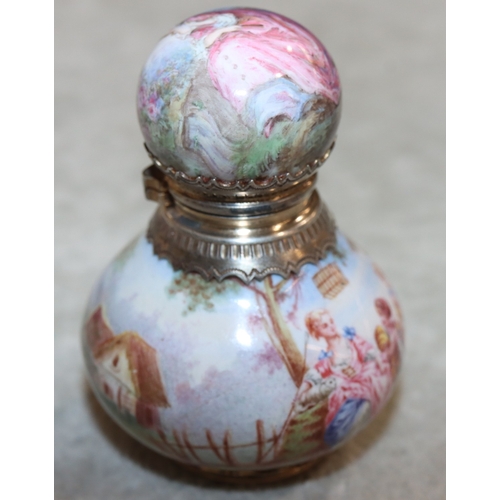 737 - A Continental enamelled and silver coloured metal small round bulbous shaped scent bottle with hinge... 