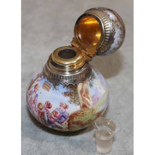 737 - A Continental enamelled and silver coloured metal small round bulbous shaped scent bottle with hinge... 