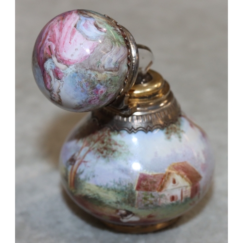 737 - A Continental enamelled and silver coloured metal small round bulbous shaped scent bottle with hinge... 