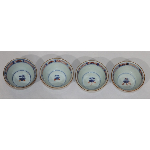 79 - A set of 4 19th Century Oriental Imari pattern round trumpet shaped tea bowls on white, red and blue... 