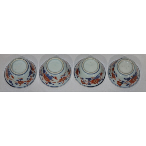 79 - A set of 4 19th Century Oriental Imari pattern round trumpet shaped tea bowls on white, red and blue... 