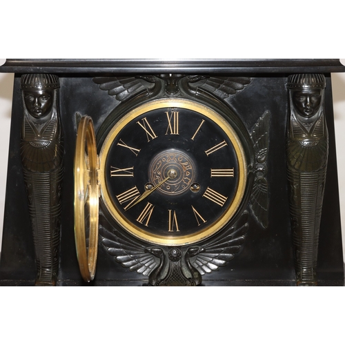 898 - A heavy black slate 8-day striking mantel clock with marble Egyptian sphinx to top, black dial surro... 
